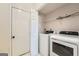 The laundry room includes a washer, dryer, and storage, making laundry day a breeze at 113 Hitchcock Dr, Villa Rica, GA 30180