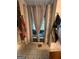 Stylish bathroom showcases a curtained tub and patterned flooring, offering privacy and charm at 974 Bloomfield Dr, Lawrenceville, GA 30044