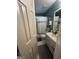 Well-lit bathroom features a shower/tub combo, vanity, and neutral decor for a clean, functional space at 974 Bloomfield Dr, Lawrenceville, GA 30044