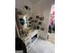 Bathroom featuring a vanity with drawers, patterned tile flooring, and access to a walk-in closet at 974 Bloomfield Dr, Lawrenceville, GA 30044