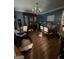 Dining room features hardwood floors and a classic chandelier at 974 Bloomfield Dr, Lawrenceville, GA 30044