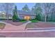 Charming single-story home with inviting walkway, manicured landscaping, and a warm, welcoming facade at 974 Bloomfield Dr, Lawrenceville, GA 30044