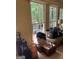 An indoor space with windows showing the back porch with outdoor furniture at 974 Bloomfield Dr, Lawrenceville, GA 30044