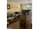 Kitchen during move with sink, appliances, shelves, and boxes at 974 Bloomfield Dr, Lawrenceville, GA 30044