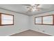 Bedroom with two windows with mini blinds and a ceiling fan at 1189 E Fayetteville Rd, Riverdale, GA 30296