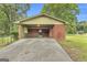 Carport exterior with ample parking and brick walls at 1189 E Fayetteville Rd, Riverdale, GA 30296