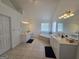 Bright bathroom featuring dual vanities, soaking tub, and neutral tile flooring at 176 Fairoaks Cir, Stockbridge, GA 30281