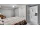 Bright bedroom with double closets, carpet, neutral tones, and ensuite bathroom access at 3359 Villa Ln, Douglasville, GA 30135
