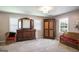 Bedroom featuring large furniture, gray carpet, natural light, and a small seating area at 3359 Villa Ln, Douglasville, GA 30135