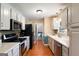 Modern kitchen with stainless steel appliances, white cabinets, and ample counter space at 3359 Villa Ln, Douglasville, GA 30135