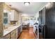 Well-equipped kitchen featuring white cabinets, stainless steel appliances, and a view of the breakfast nook at 3359 Villa Ln, Douglasville, GA 30135