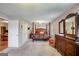 Spacious main bedroom featuring a four-poster bed, dresser, and view to office at 3359 Villa Ln, Douglasville, GA 30135