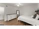 Bedroom features hardwood floors, a ceiling fan, a closet and a large white dresser at 603 Brighton Pt, Atlanta, GA 30328