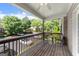 Covered deck overlooking the neighborhood featuring a small table and chairs at 603 Brighton Pt, Atlanta, GA 30328