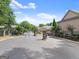 View of a gated entrance to a residential community, with stone pillars and lush landscaping at 603 Brighton Pt, Atlanta, GA 30328