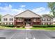 Apartment building with brown exterior, black shutters, manicured landscaping, and an inviting front entrance at 603 Brighton Pt, Atlanta, GA 30328