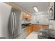 Modern kitchen equipped with stainless steel appliances and wooden cabinets for a functional space at 603 Brighton Pt, Atlanta, GA 30328