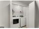 A laundry room with appliances is a practical space with easy to use machines for added convenience at 603 Brighton Pt, Atlanta, GA 30328