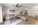 Spacious living room with a fan, couches, a coffee table, and decor showcasing an open layout at 603 Brighton Pt, Atlanta, GA 30328