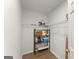 Well-organized storage room featuring shelving and laminate flooring at 603 Brighton Pt, Atlanta, GA 30328