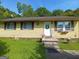 Charming single-story home with yellow siding and a well-manicured lawn at 649 Mary Ln, Marietta, GA 30062