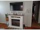 Cozy living room with a modern fireplace, TV, and a snake plant at 649 Mary Ln, Marietta, GA 30062