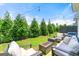 A cozy backyard featuring a seating area with comfortable furniture and a modern fire pit at 1316 Willamette Way, Marietta, GA 30008