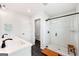 Bathroom featuring a tiled shower, glass doors, and modern fixtures at 1316 Willamette Way, Marietta, GA 30008