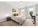 Bright bedroom with two large windows offering natural light, complemented by modern furnishings at 1316 Willamette Way, Marietta, GA 30008