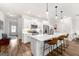 Charming kitchen with a large island, stainless steel appliances, and sleek white cabinets at 1316 Willamette Way, Marietta, GA 30008
