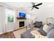 Comfortable living room features a fireplace, plush sofa, large windows, and stylish decor at 1316 Willamette Way, Marietta, GA 30008