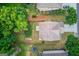 Aerial view of a home showcasing its roof, driveway, and a spacious, fully fenced backyard at 2030 Beyers Landing Dr, Buford, GA 30519