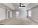 Bright and spacious Primary bedroom featuring trey ceiling, ceiling fan and a view of the doorway at 2030 Beyers Landing Dr, Buford, GA 30519