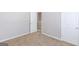 Bedroom has neutral walls and carpeting, with white base trim, doors, and door hardware at 2030 Beyers Landing Dr, Buford, GA 30519