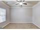 Spacious bedroom with neutral walls, carpet and ceiling fan at 2030 Beyers Landing Dr, Buford, GA 30519