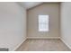 Bedroom has a single window, neutral walls and carpeting, and white base trim at 2030 Beyers Landing Dr, Buford, GA 30519