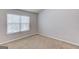 Bedroom with a window has neutral walls, carpet, and base trim at 2030 Beyers Landing Dr, Buford, GA 30519