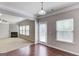 Dining area with wood flooring, fireplace view, and ample natural light at 2030 Beyers Landing Dr, Buford, GA 30519