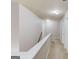 Second-floor hallway with neutral carpet, white doors and trim leading to other rooms at 2030 Beyers Landing Dr, Buford, GA 30519