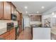 Modern kitchen with stainless steel appliances, granite counters, and open layout at 2030 Beyers Landing Dr, Buford, GA 30519