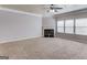 Spacious living room with carpet and fireplace with decorative trim at 2030 Beyers Landing Dr, Buford, GA 30519