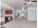 Open-concept living room featuring neutral carpeting, ceiling fan, and stairway at 2030 Beyers Landing Dr, Buford, GA 30519