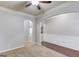 Open living area with carpeted floors and view of stairway at 2030 Beyers Landing Dr, Buford, GA 30519