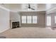 Spacious living room with carpet and fireplace and a set of windows at 2030 Beyers Landing Dr, Buford, GA 30519