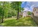 Backyard features a deck, storage shed, and a well-maintained lawn at 3781 Deercreek Dr, Powder Springs, GA 30127
