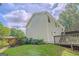 Backyard features a deck, lush garden and green lawn at 3781 Deercreek Dr, Powder Springs, GA 30127