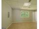 View of basement space with a window and tile flooring at 3781 Deercreek Dr, Powder Springs, GA 30127