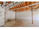 Unfinished basement with exposed beams, duct work, and concrete floor offers potential for customization at 3781 Deercreek Dr, Powder Springs, GA 30127