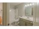 Clean bathroom with a shower-tub combo, single sink vanity, and modern mirror at 3781 Deercreek Dr, Powder Springs, GA 30127