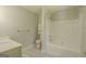 Bathroom with vanity, shower and tub combo, and storage cabinet at 3781 Deercreek Dr, Powder Springs, GA 30127